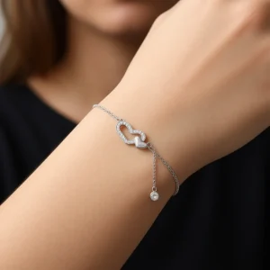 دستبند نقره دخترانه مدل دو قلب نگین دار با آویز