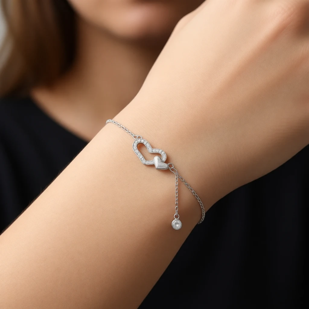 دستبند نقره دخترانه مدل دو قلب نگین دار با آویز